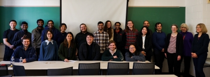 Large group of chemical and biochemical engineering graduate students and professors posing for a group photo.